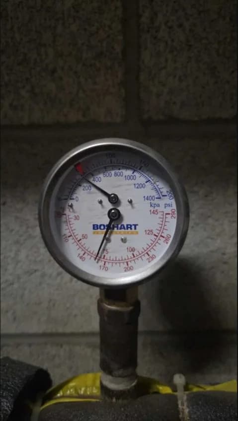 Temperature and pressure gauge reading recorded during boiler maintenance