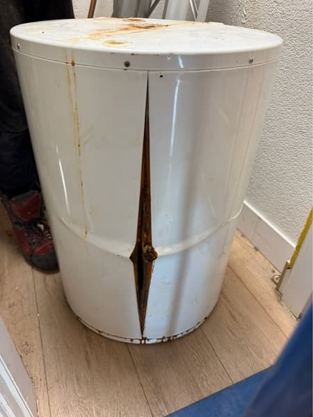 Failed and split hot-water tank after removal