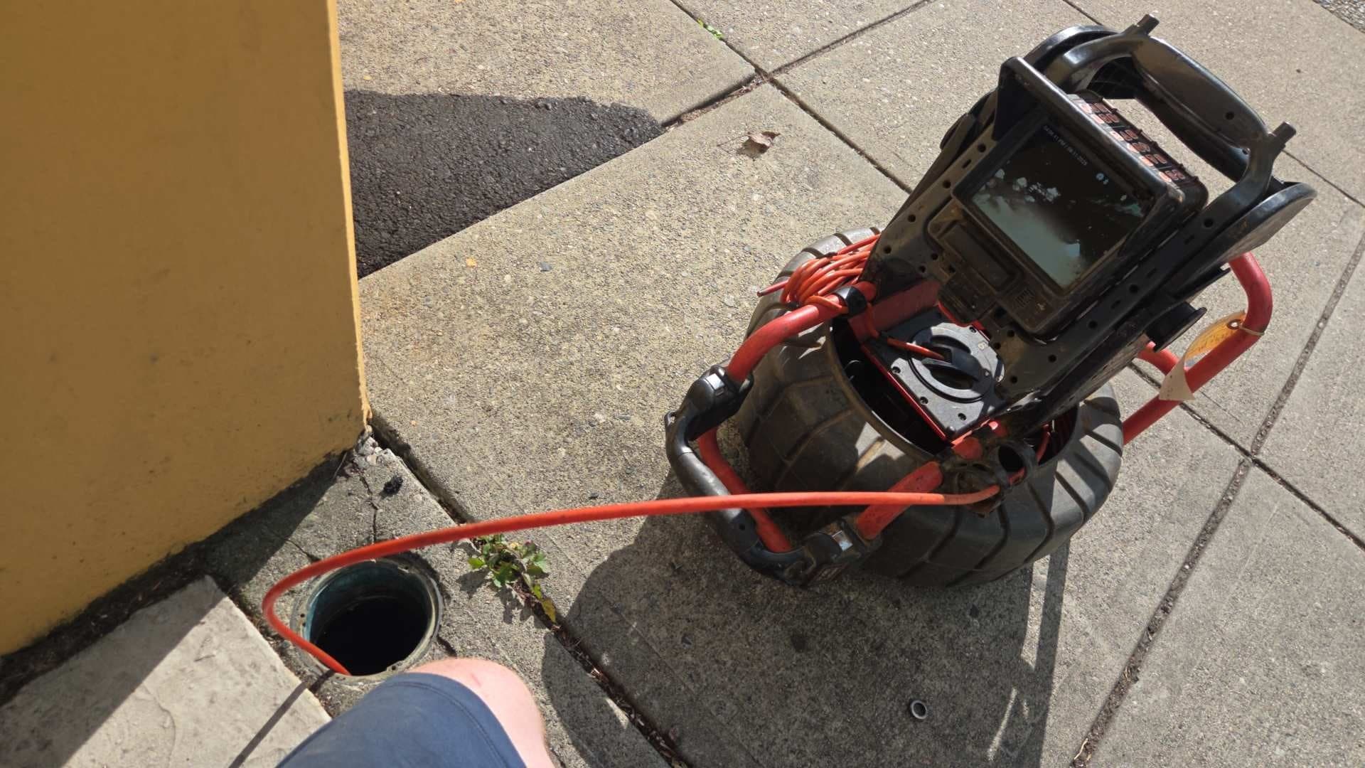 Drain camera and cable set up at an exterior commercial cleanout