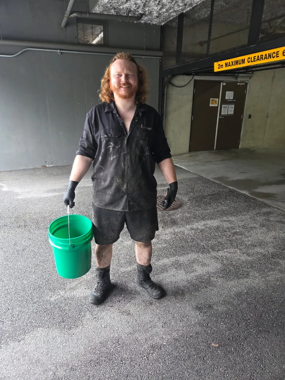 Pure Mechanical technician on site at a multi-unit parkade