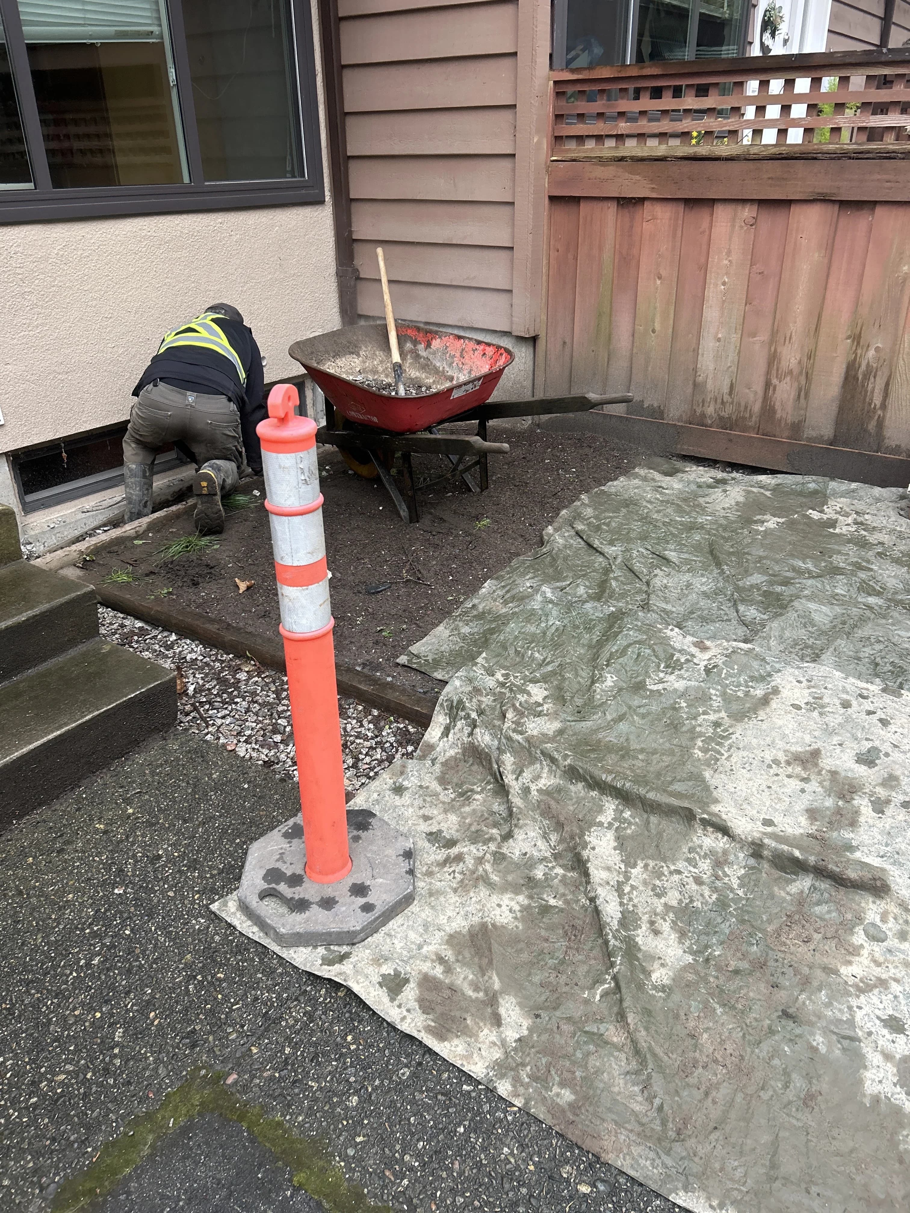 Exterior work area prepared for perimeter drainage access