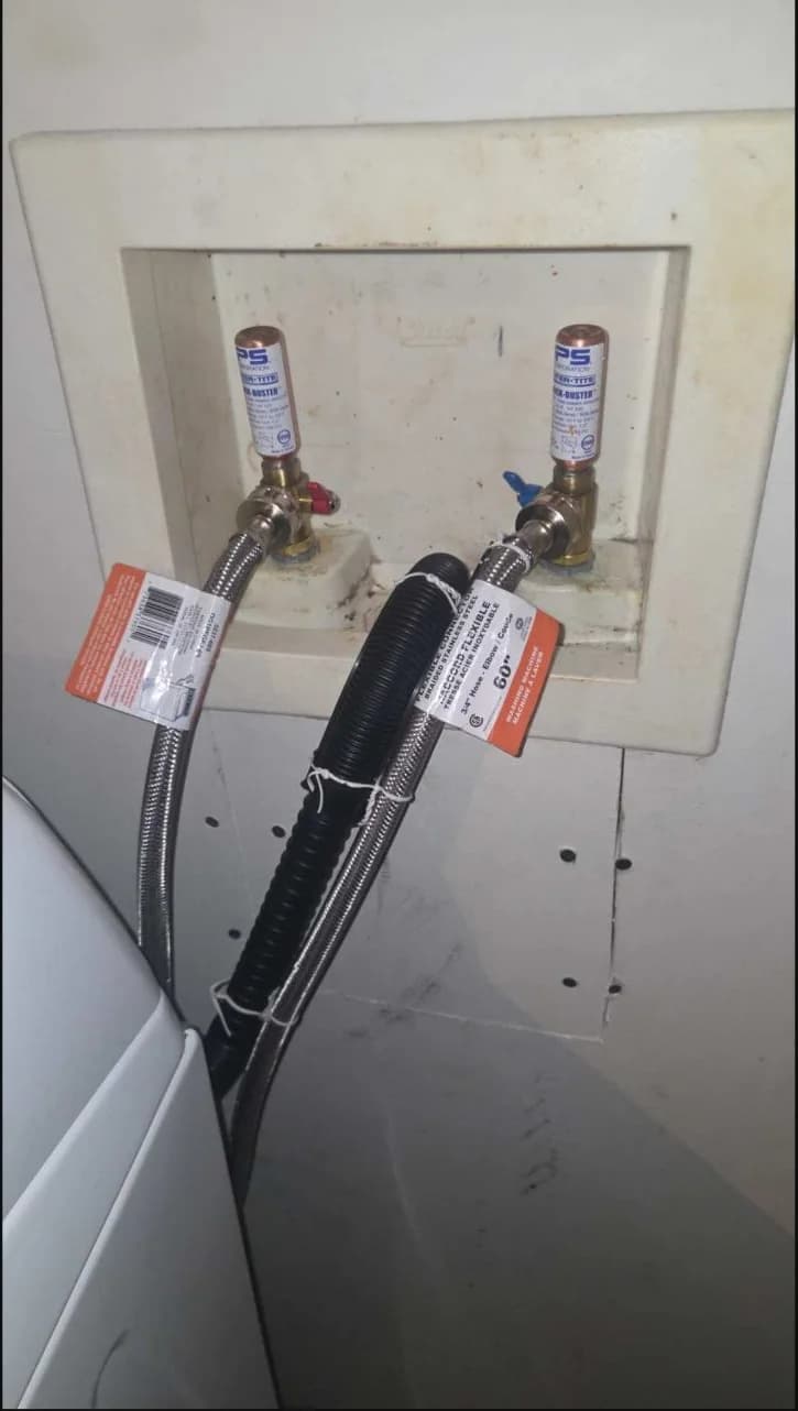 New washing-machine supply hoses connected to residential shutoff valves
