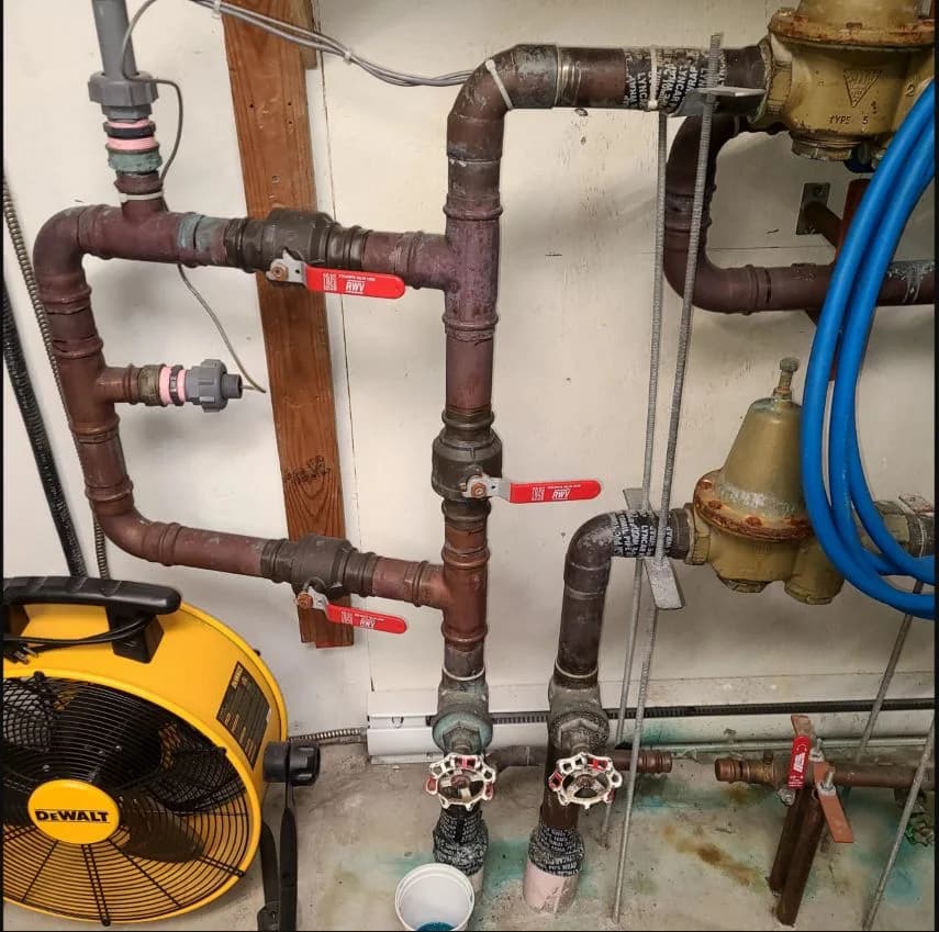 Multi-unit water-entry manifold isolated during a documented leak repair