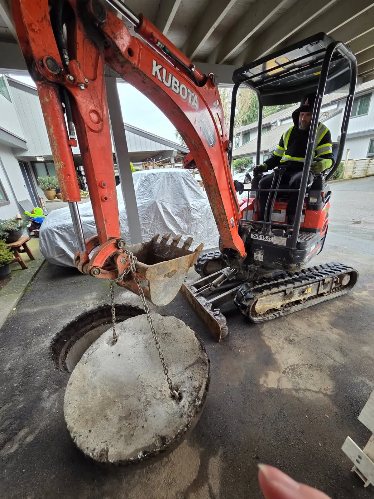 Compact excavation equipment positioned for controlled underground plumbing access
